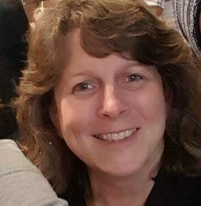 Smiling woman with wavy hair