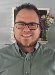 man in buttoned shirt