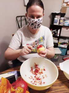 Kristen peeling an apple