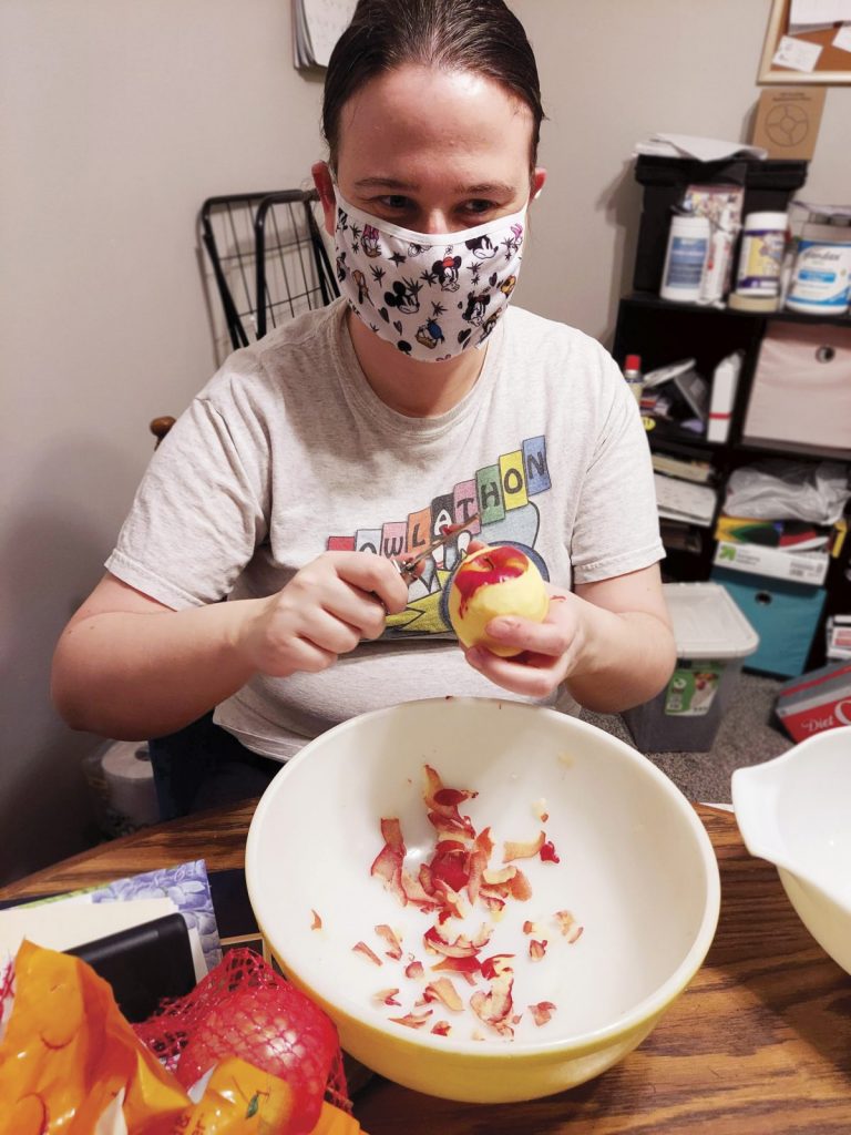 Kristen peeling an apple