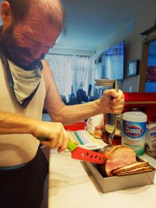 Robert cutting his ham